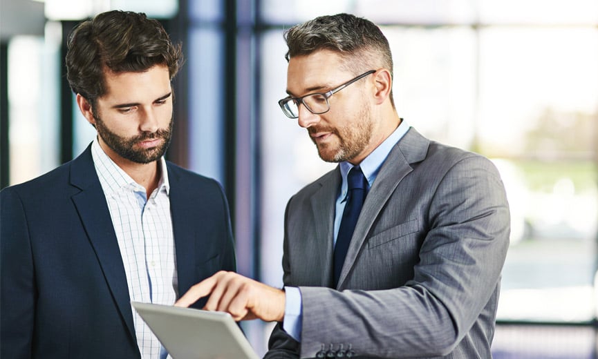 A business owner reviewing his business insurance options