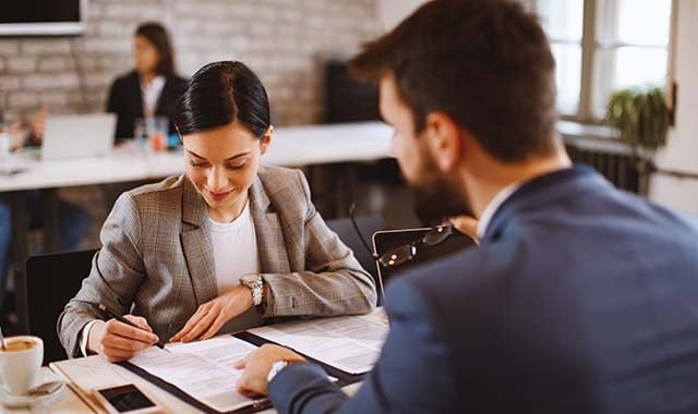 employee signing a life insurance as a voluntary benefit that her employer offered through Paychex