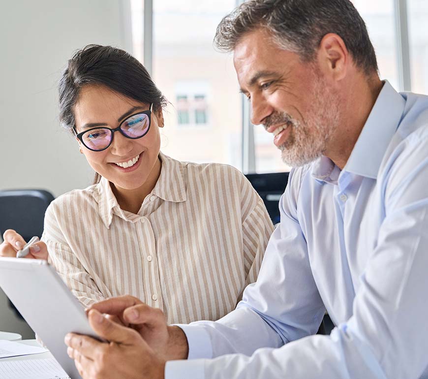 two people filling a questionnaire on a tablet