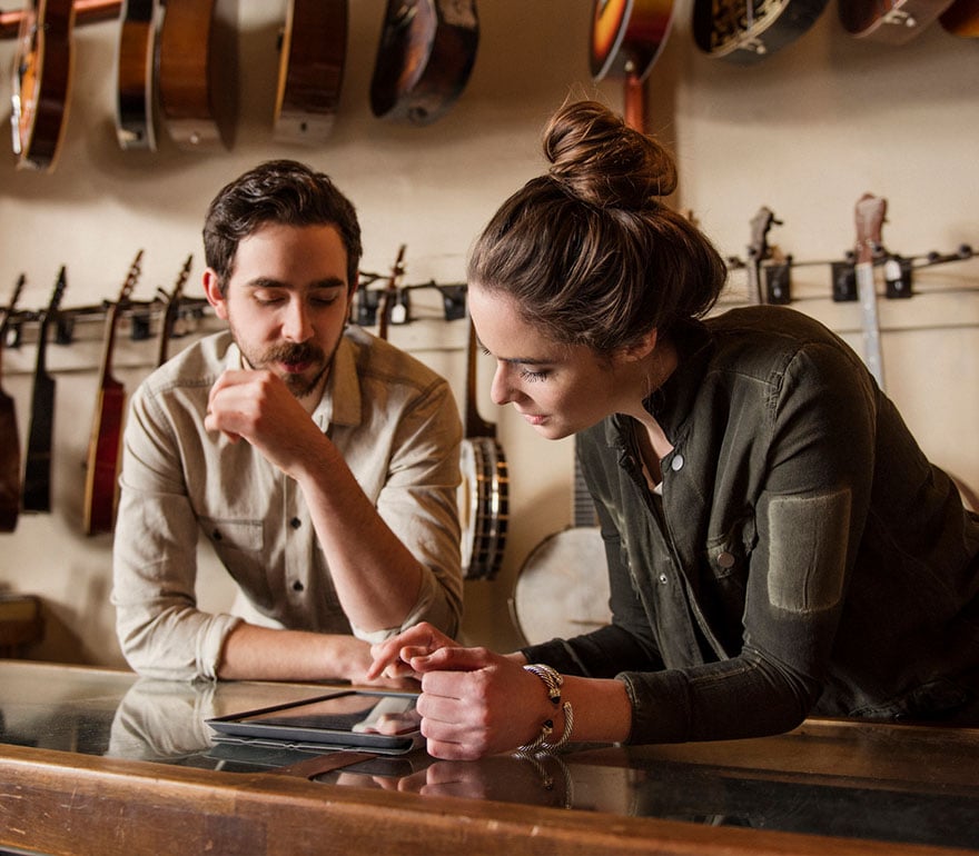 Small business owners working on a tablet