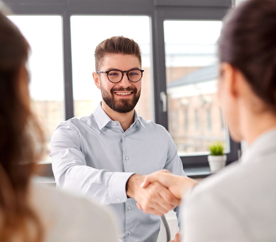 A job candidate shaking hands 