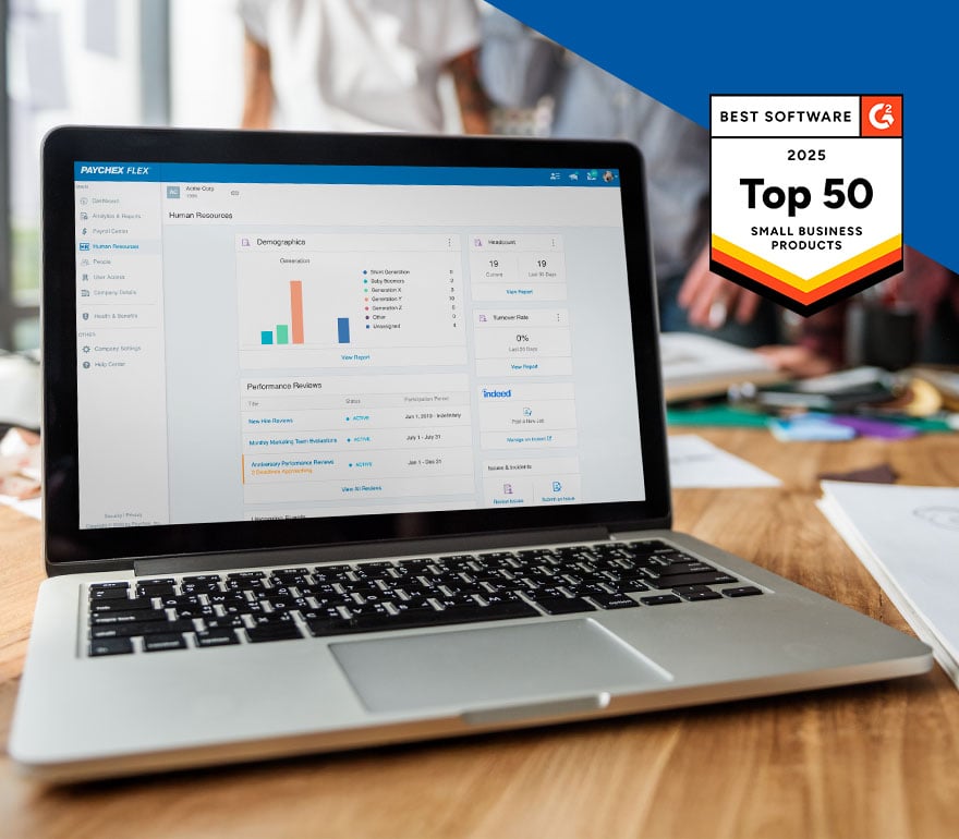 A laptop showing the HR dashboard in Paychex Flex