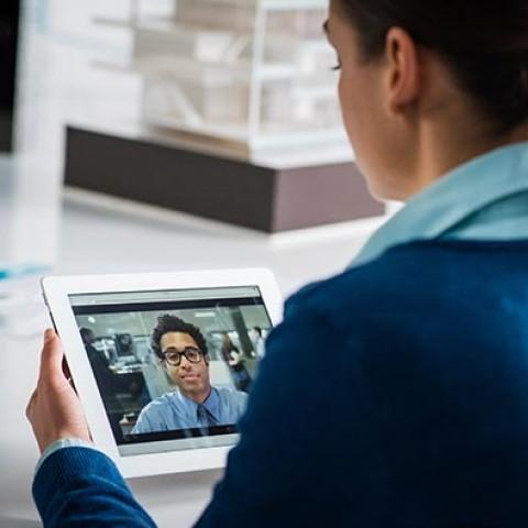 Women having a video conference with a co-worker (Virtual Workplace)