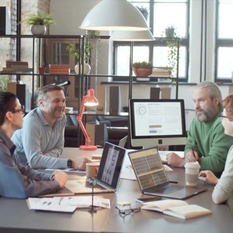 A busy office with employee working together