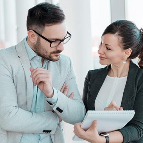 Two financial advisors talking
