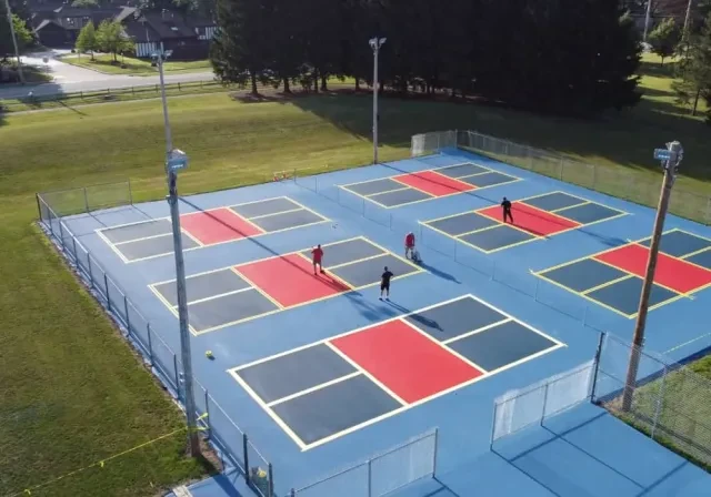 drone view of blue and red pickleball courts